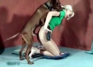 Sweet blonde is playing with her dog